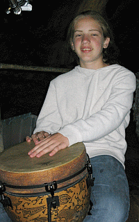 Lydia Yoder on the djembe